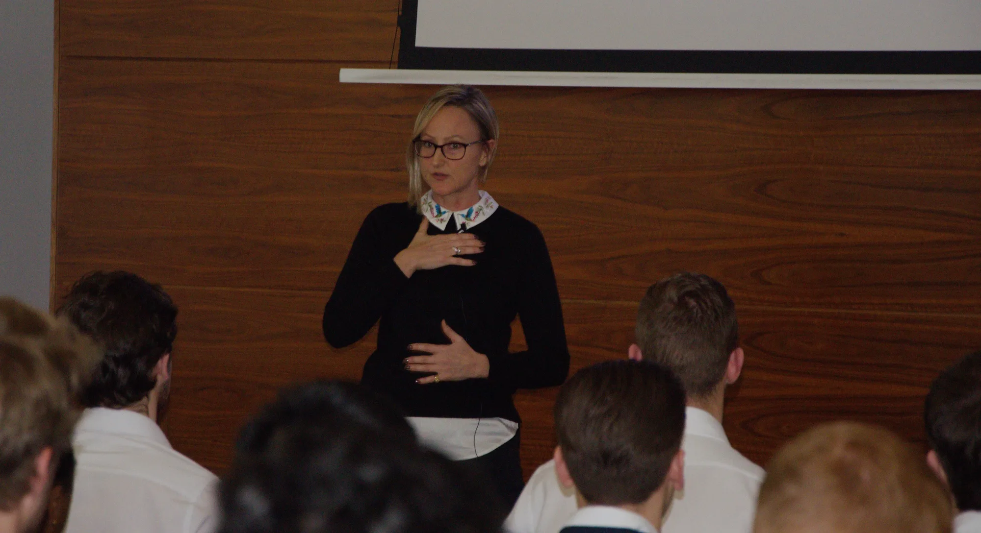 Helena speaking to an audience at RICS